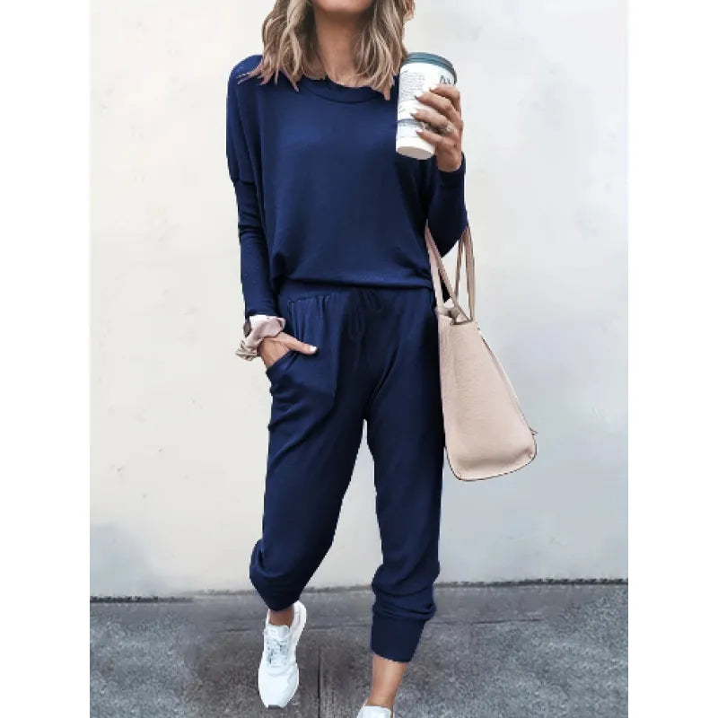 Model wearing a comfortable women's crew neck & jogger matching set, perfect for lounging or errands.
