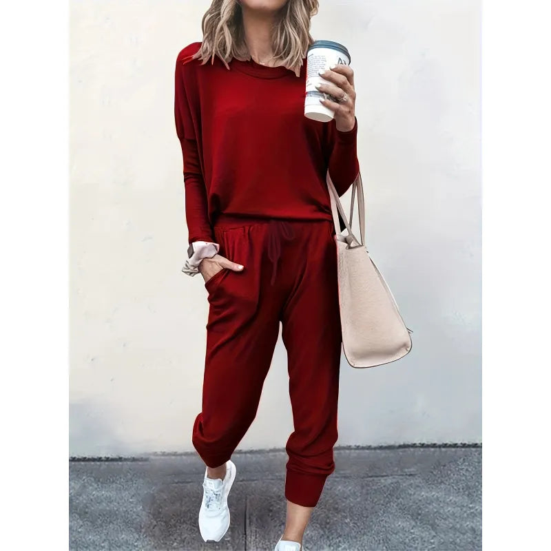 Soft women's matching set: long-sleeve crew neck top and elastic-waist jogger pants for ultimate comfort.