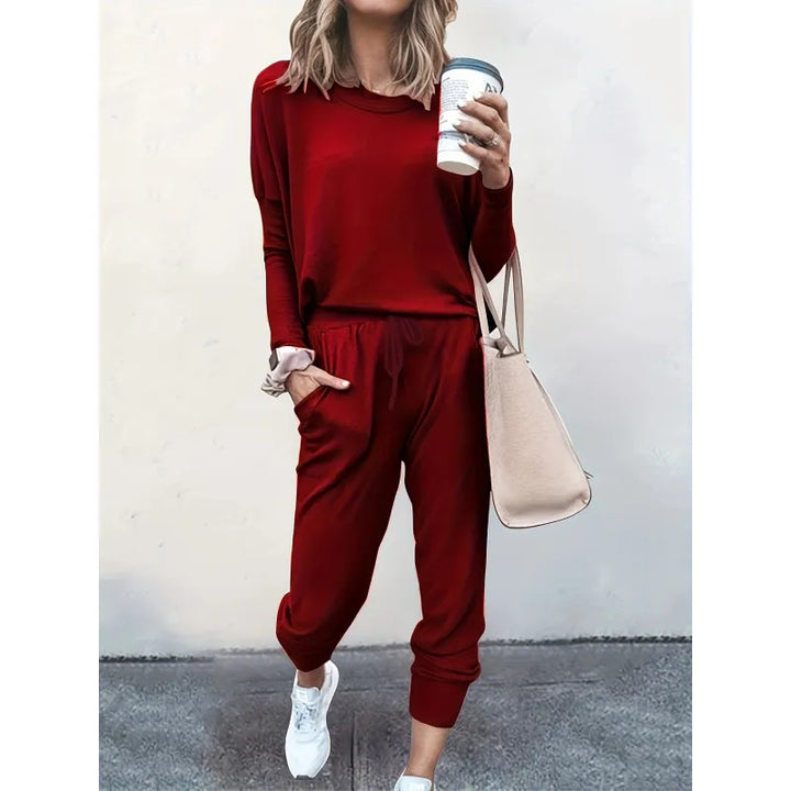 Soft women's matching set: long-sleeve crew neck top and elastic-waist jogger pants for ultimate comfort.