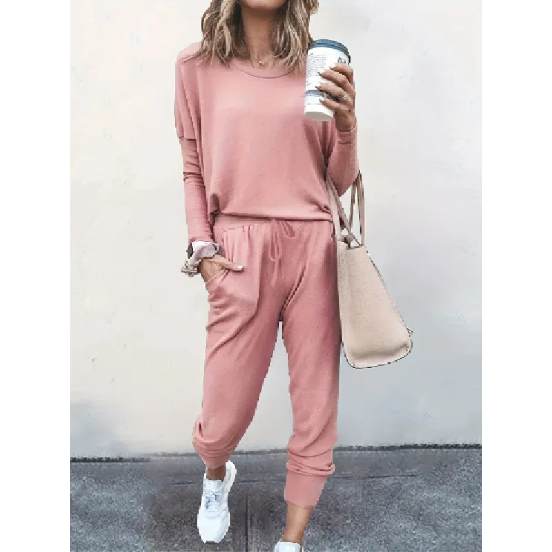 Versatile women's cozy set including a crew neck top & jogger bottoms, great for home or casual outings.