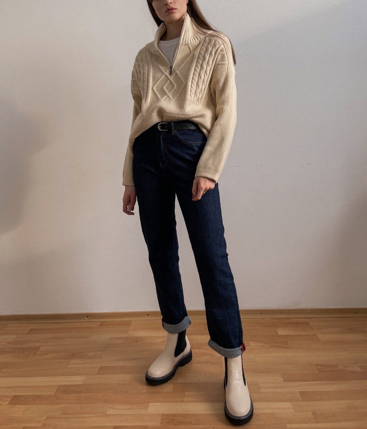 Model wearing a comfortable women's oversized knit pullover sweater, showcasing its relaxed fit and fall style.