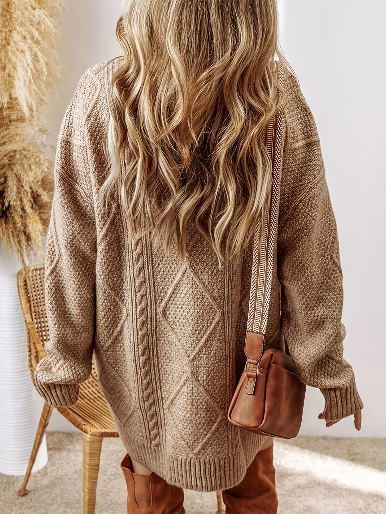 Chic women's oversized sweater dress with drop shoulder & ribbed detail for versatile style.