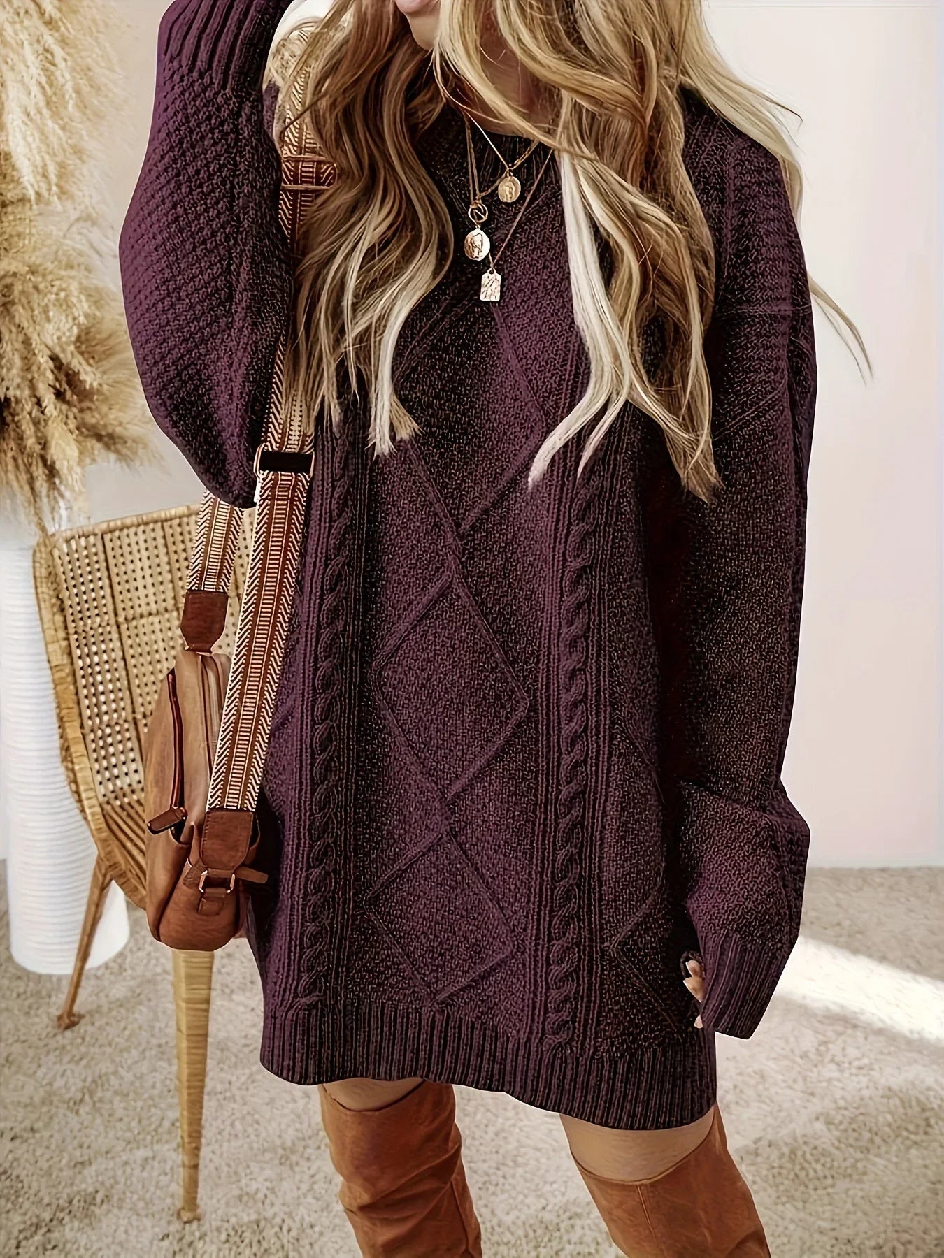 Elegant women's oversized sweater dress, relaxed fit, soft fabric, perfect for fall fashion.