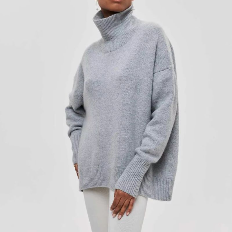 Woman walking casually in a cozy oversized turtleneck pullover, a perfect relaxed fit for everyday fall fashion.