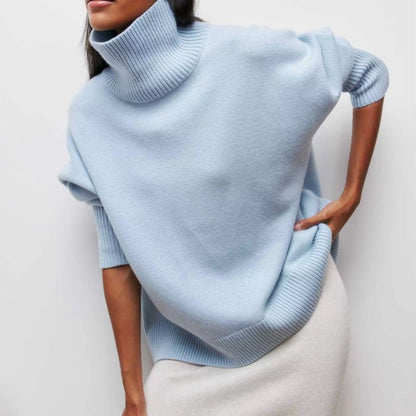 Woman wearing a relaxed fit oversized turtleneck pullover, ideal for casual wear & layering in winter.