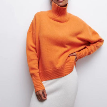 Back view of a women's oversized turtleneck pullover, highlighting its relaxed fit and cozy loungewear style.