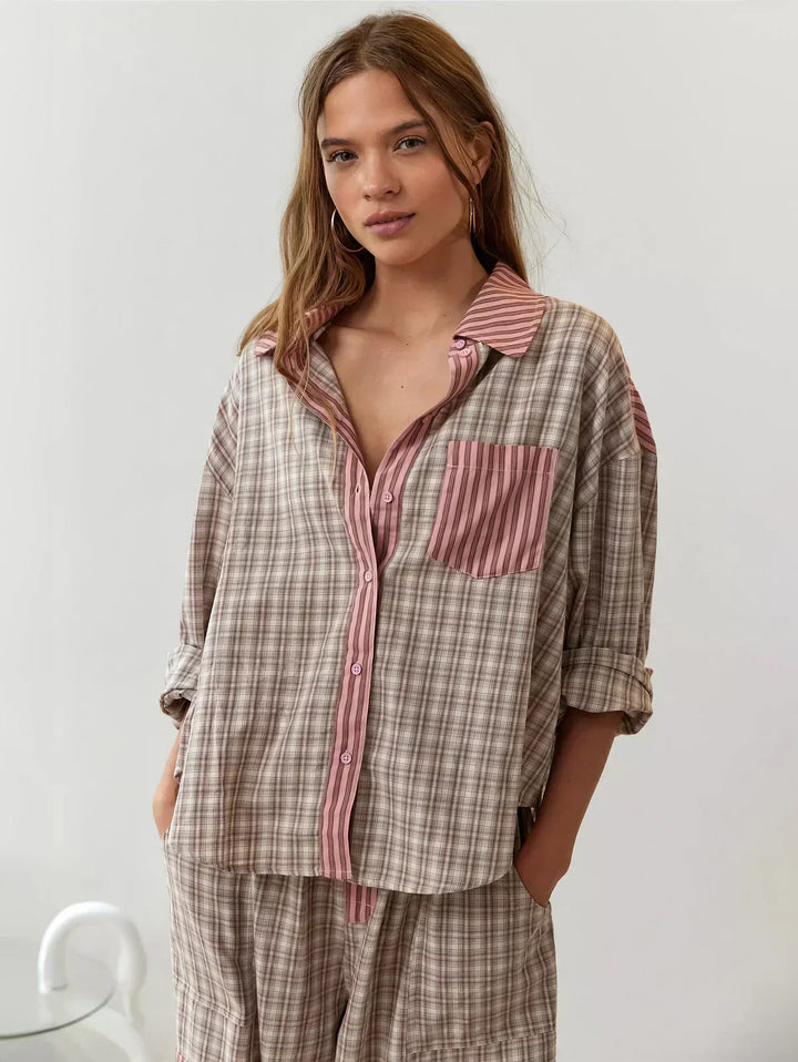Women's cozy plaid button-up pajama set. Two-piece loungewear for comfortable sleep and relaxed home wear.