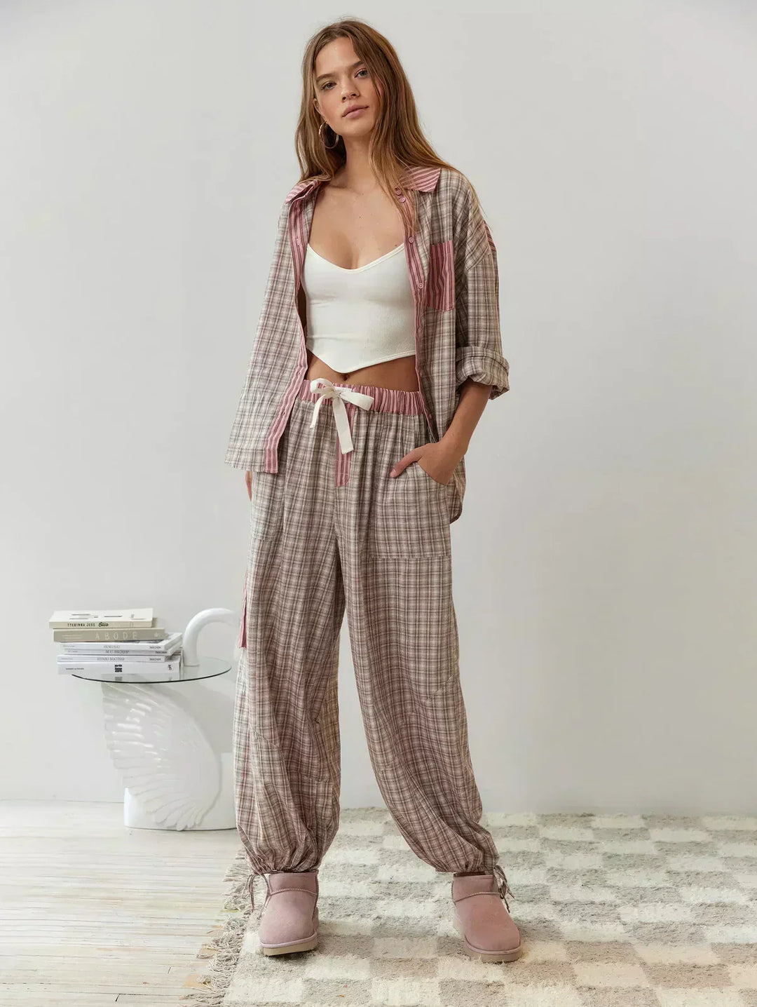 Relaxed fit women's plaid loungewear set. Warm button-up pajamas for cozy comfort, ideal for sleep and home.
