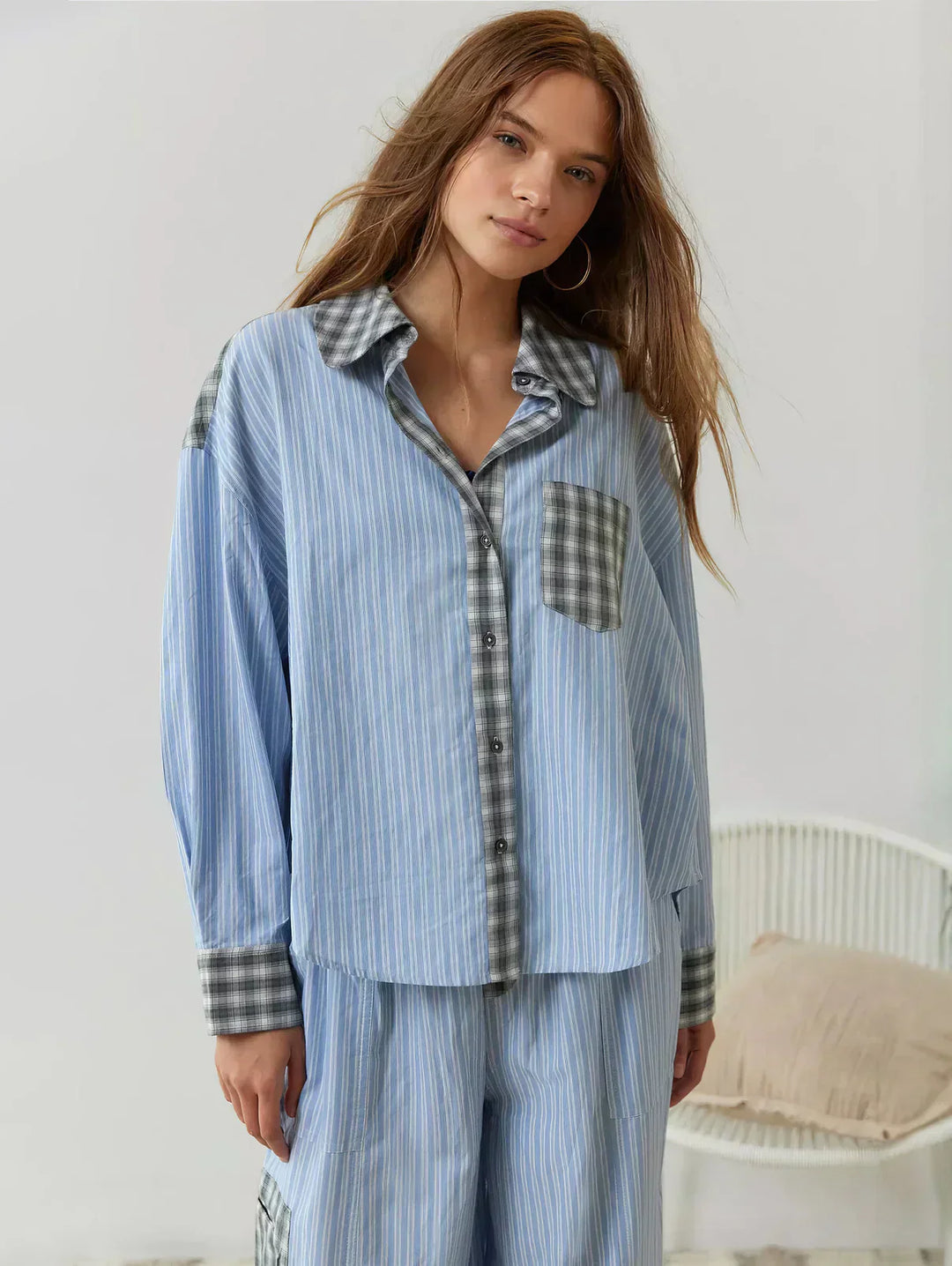 Classic women's plaid button-up sleepwear set. Two-piece design for ultimate cozy comfort and stylish relaxation.