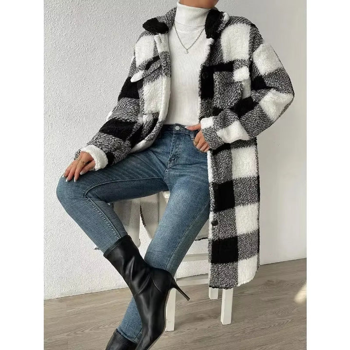 Cozy women's winter jacket in plaid. Longline design, stand collar, and warm for cold weather.