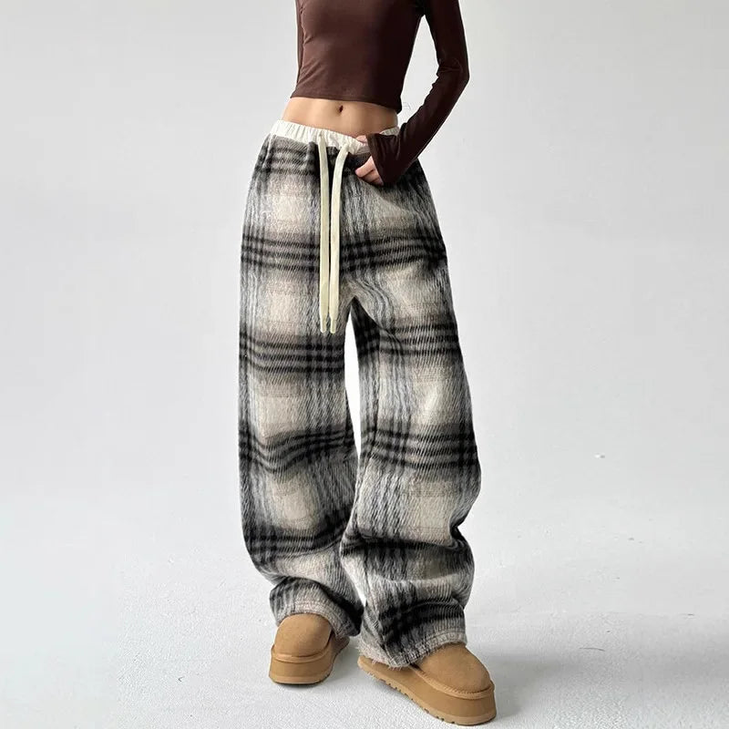 Women's relaxed fit plaid wide-leg trousers, versatile for casual wear & comfortable loungewear.