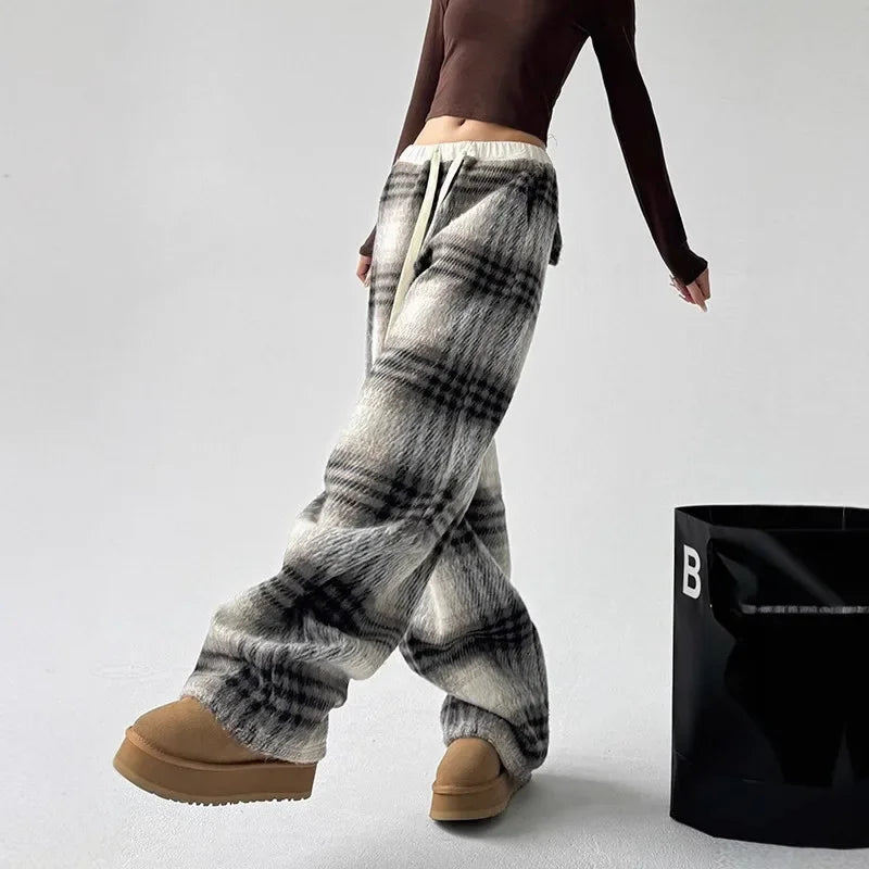 Classic plaid pattern on women's cozy trousers. Wide leg, perfect for casual outings or home comfort.