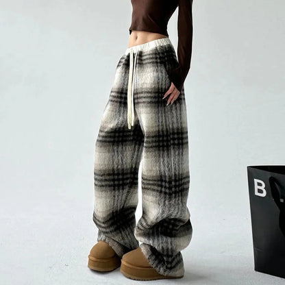 Comfortable women's wide-leg plaid trousers, a relaxed fit fashion staple for fall & winter.