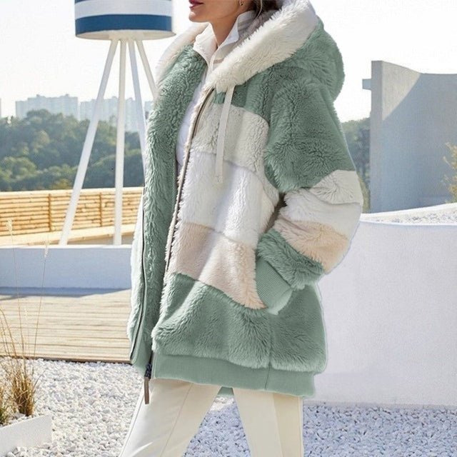 Soft plush women's hooded jacket. Cozy outerwear offering warmth and style for winter comfort.