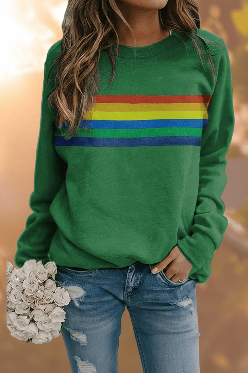 Woman wearing a comfortable women's rainbow striped pullover sweatshirt. Casual, cozy everyday look.