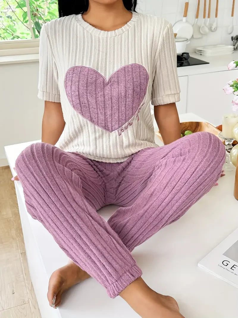 Women's cozy ribbed loungewear set with cute heart motif. Perfect for relaxing at home or casual wear.