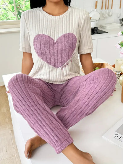 Women's cozy ribbed loungewear set with cute heart motif. Perfect for relaxing at home or casual wear.