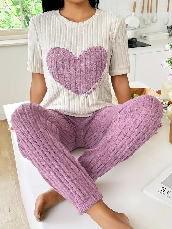 Women's cozy ribbed loungewear set with cute heart motif. Perfect for relaxing at home or casual wear.