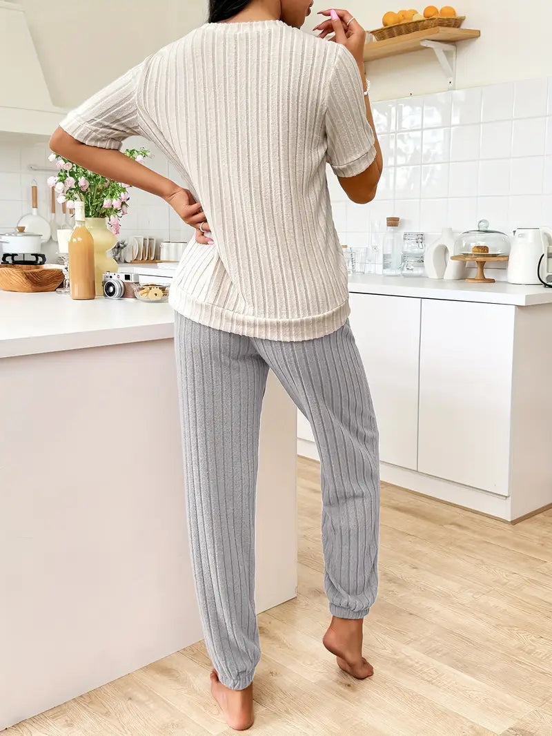 Ribbed women's loungewear set with a unique heart motif, offering cozy comfort and stylish casual wear.