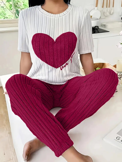 Elegant women's loungewear set: ribbed fabric, heart motif, designed for ultimate relaxation & style.