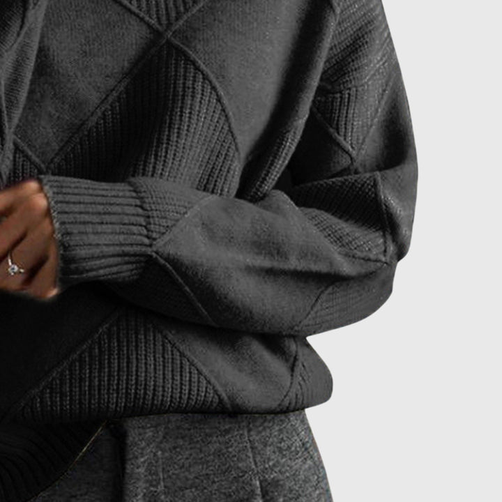 Detail shot of the graceful roll neck and soft material of this women's cozy jumper.