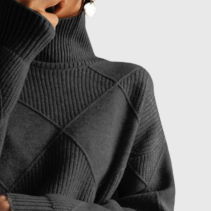 Diagonal seam detail on the side of the women's oversized sweater, adding a modern touch.