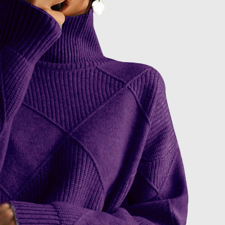 Side profile of a woman in her warm, relaxed fit roll neck jumper with stylish seams.