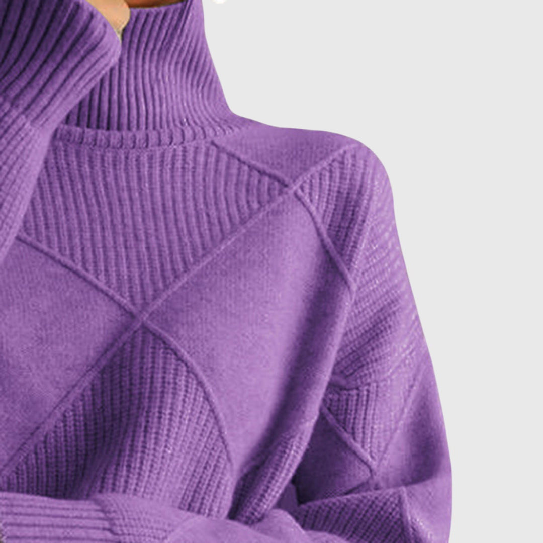 Close-up of the plush fabric texture and unique diagonal seam on the women's roll neck sweater.