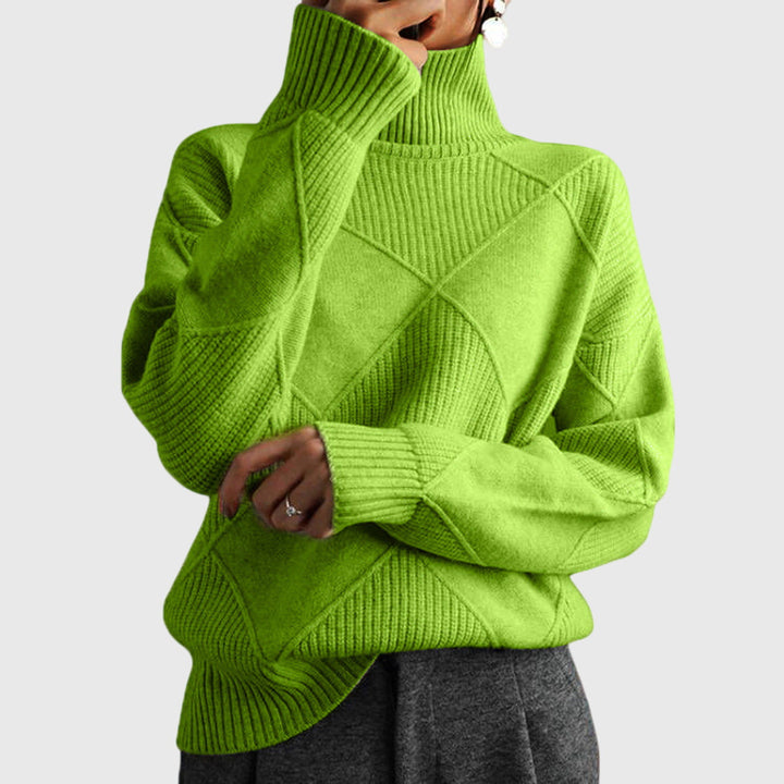 Back view of the women's oversized jumper, highlighting the elegant diagonal seam design.