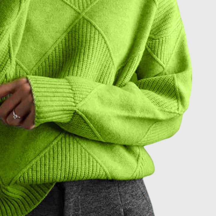 Chic women's winter sweater with a cozy roll neck, designed for both warmth and sophisticated style.