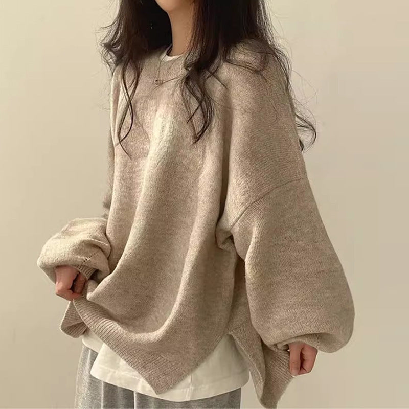 Close-up of a women's oversized cozy knit sweater with a stylish split hem, perfect for casual comfort.