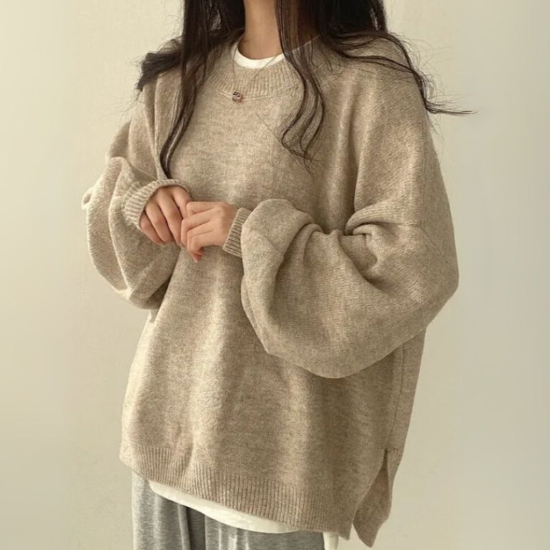 Woman wearing a comfortable, relaxed fit women's cozy split hem sweater, ideal for casual fall fashion.