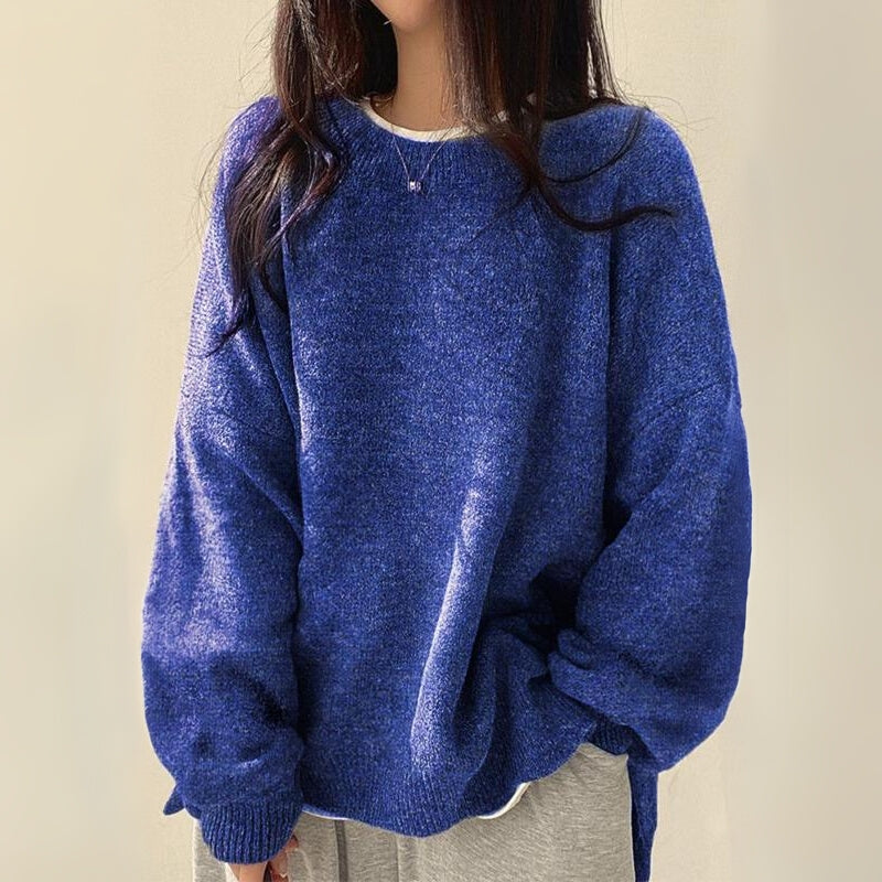 Full view of a women's long sleeve cozy pullover sweater with an elegant split hem, perfect for winter style.