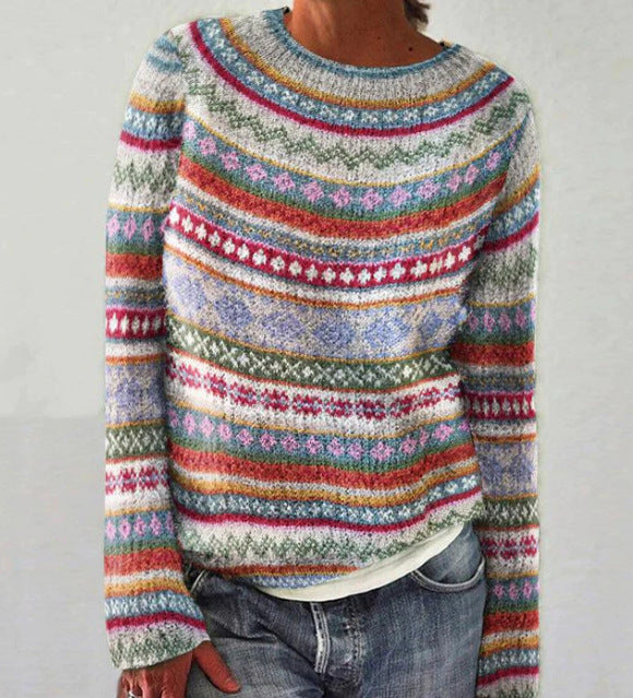 Stylish women's loose-fit striped knit sweater, offering effortless comfort for chilly autumn days.