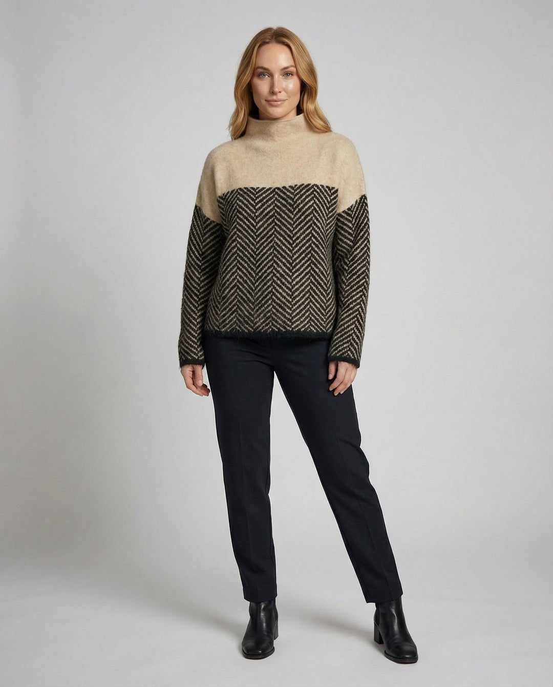 Women's cozy textured turtleneck sweater in soft knit, perfect for winter warmth and everyday elegance.