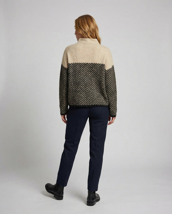 Textured long sleeve turtleneck sweater for women, featuring a cozy knit and sophisticated design.