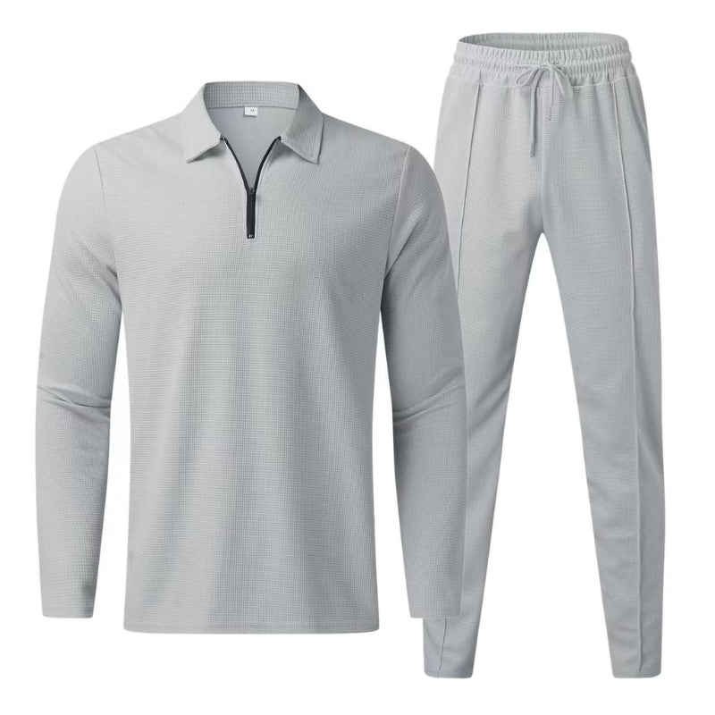 Stylish women's activewear lounge set featuring a waffle knit zip-up top & joggers for ultimate comfort.