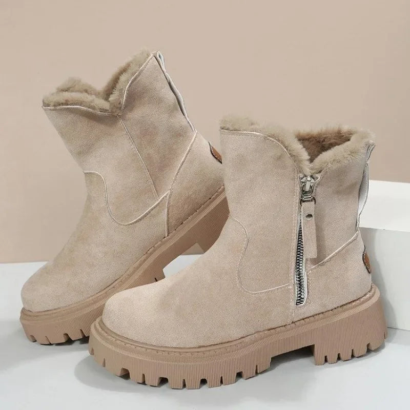 Grey women's cozy boots, ideal for snowy days, featuring a functional side zipper.