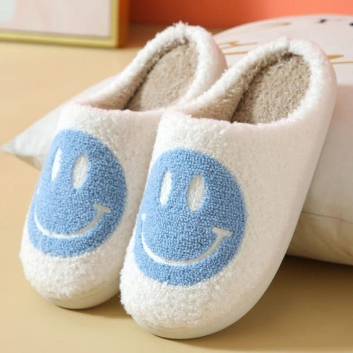 Women's indoor house slippers, cozy and warm, featuring a playful smiley face and a robust sole.