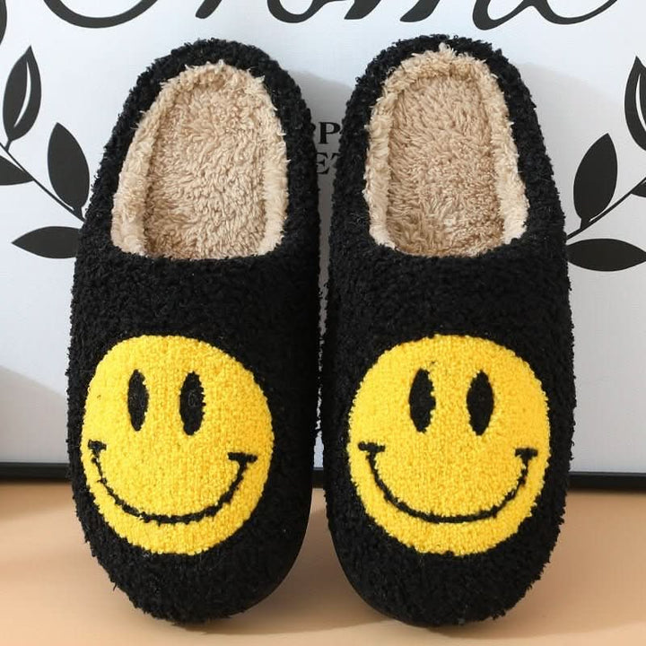 Soft women's winter slippers with a thick, supportive sole and an embroidered smiley face for home wear.