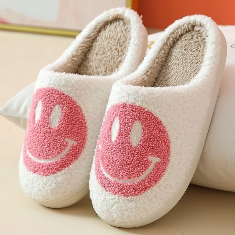 Cozy women's slippers for winter, featuring a smiley face and a secure anti-slip sole for indoor use.
