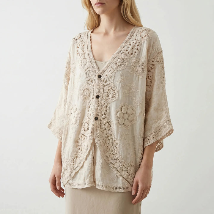 Bohemian women's cream open-front cardigan. Features a relaxed fit, textured knit, and three-quarter sleeves; ideal summer layer.