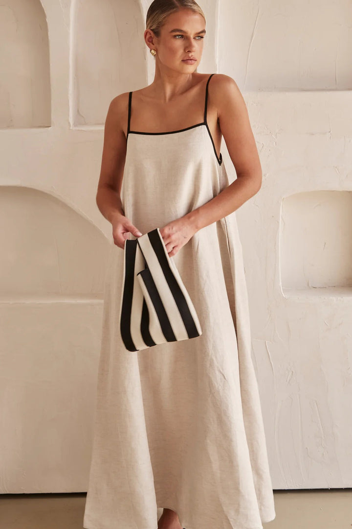 Casual yet elegant cream A-line maxi dress for women, ideal for summer resort wear. Square neck & spaghetti strap design.