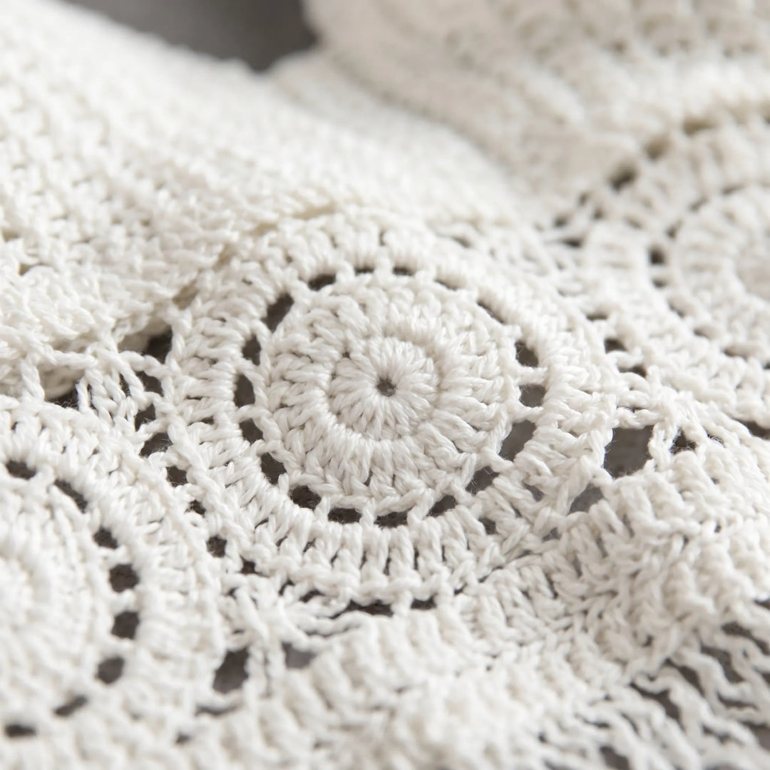 Sleeveless adjustable women's crochet halter crop top, an essential for summer, beach, and resort wear.