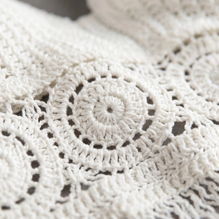 Sleeveless adjustable women's crochet halter crop top, an essential for summer, beach, and resort wear.