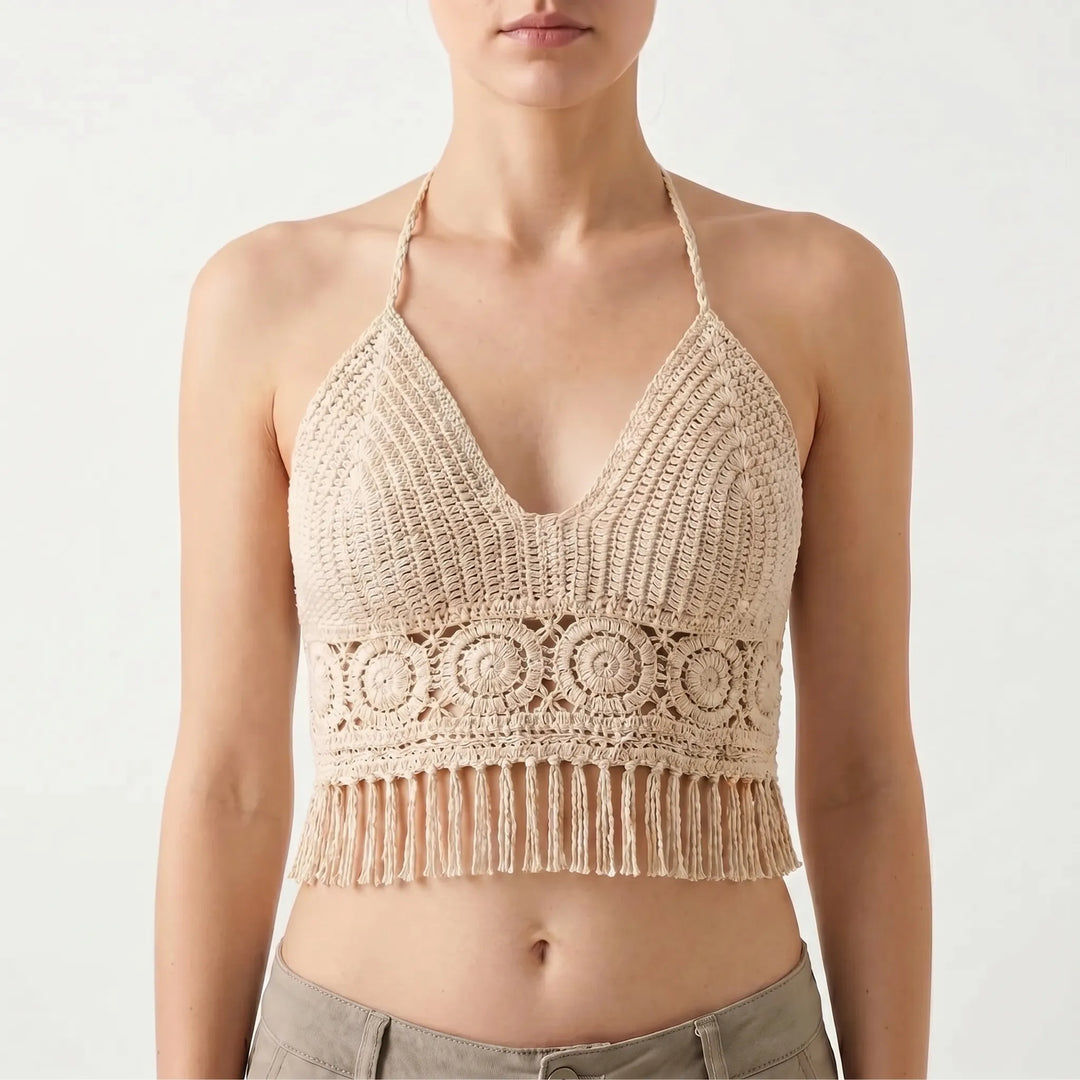 Chic women's crochet halter crop top with fringe hem, great for vacation, resort, and summer outfits.