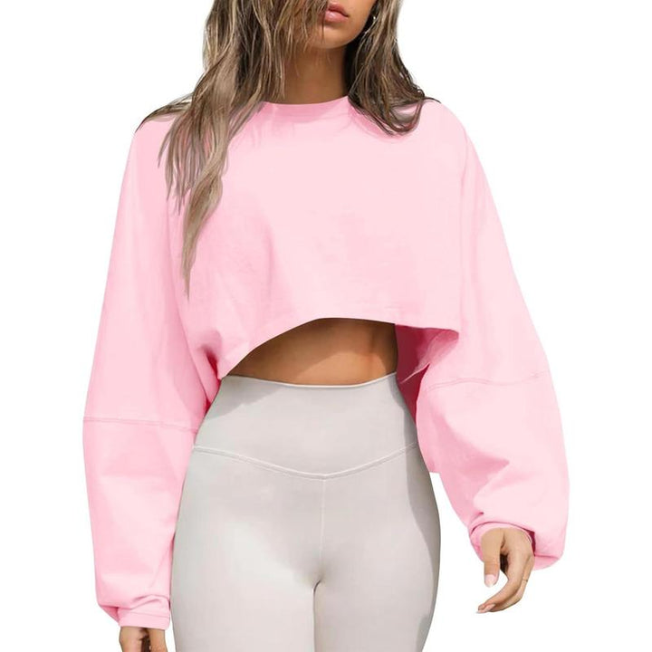 Trendy cropped oversized sweatshirt for women, featuring a classic crewneck design for everyday wear.