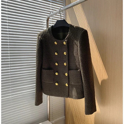 Stylish women's cropped tweed jacket, a chic statement piece for elegant outfits. Modern women's fashion.