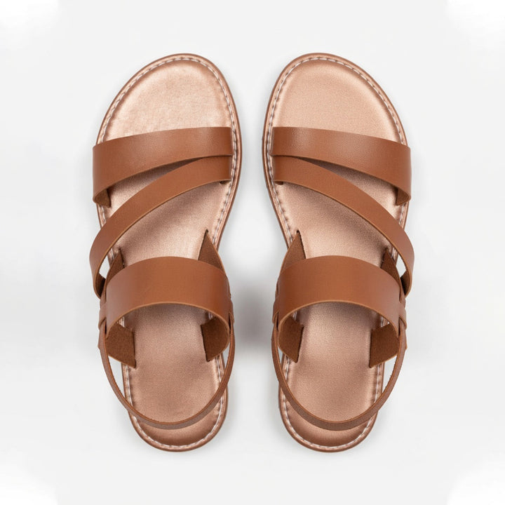 Comfortable women's open-toe flat sandals featuring chic crossover straps for everyday summer style.