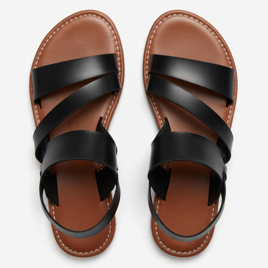 Women's summer flat sandals: comfortable open-toe design with stylish crossover straps for casual days.